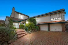  62 Woodhouse Grove Box Hill North VIC 3129 A whopping 1,230sqm of land is surrounded by a secure brick fence and plays host to this unique split level four bedroom family home, conveniently located in a quiet locale, only minutes' walk to several quality schools. Five minutes' drive to Box Hill train station, this home has excellent street appeal with an amphitheatre styled front yard and facade positioned among a spacious tiled driveway and double lock-up garage. Families will be amazed at the huge backyard, tree-lined and with oodles of grassy space alongside an extended covered pergola and in-ground swimming pool. Upon entry to the home, two open-plan living spaces are divided by an integrated kitchen and dining, and are lavish with ornate finishes, such as ceiling roses, chandelier lighting, step-cornices, high ceilings and more. A wood fireplace with mantelpiece is found in the sitting room, while bay windows with opulent window furnishings are also placed throughout. A sun-drenched kitchen is U-shaped and framed by awning windows and 40mm round-edged counter tops with an abundance of cabinetry with stained glass touches. A wall-mounted oven is safe and convenient, while an induction cooktop and dishwasher are also big ticket items. Quality flooring is provided to the ground floor, including engineered floorboards, tile and plush carpet. The layout is unique and three bedrooms are found on the lower level, while the master is on the upper floor. Built-in robe storage is abundant, while the master vaunts a walk-in robe and private ensuite, modern with marble-look wall-high tiling, brass spindle tap ware and a generous spa bath. The main bathroom is contrasting but equally opulent with a skylight, stained glass windows and floral feature tile flourishes. Additional highlights include ducted heating, LED down lights, a separate double carport, NBN and a full alarm system. Walk to Station Street shopping village, Box Hill North Primary School and Kerrimuir Primary School. Box Hill Hospital, train station and central business district are only a few minutes by car. Property Specifications: · Four bedrooms, three living areas, elegant family home, immaculately presented with some minor renovations and classic original features · Low maintenance, yet lavish front and rear yards on a huge block boasting an in-ground pool · Unique layout that complements the natural contours of the land · High ceilings, LED lights, heating, NBN and alarm · Undercover alfresco area ideal for entertaining · Delightful suburban position, very close to great schools, parks, hospital, train station and more 