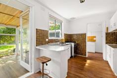  15 Brentwood Crescent Frankston VIC 3199 $640,000 - $704,000 An easy stroll to shops and schools in a popular residential precinct, this classic three bedroom home on a subdividable 617m2 (approx) allotment is brimming with potential to rent out, renovate or redevelop (STCA). Located within the McClelland College zone and within footsteps of Karingal Primary School and Karingal Village Shopping Centre, the residence is surrounded by awesome recreational facilities and just 3 minutes' drive to the major shopping, restaurants and cinemas of Karingal Hub. Drenched in natural light throughout, the layout features a spacious open-concept living and dining area with floating timber flooring, ducted heating, ceiling fan, airconditioning and north-facing windows. An original kitchen with gas stove and breakfast bar spills into the sunroom overlooking the backyard, which can be further enjoyed out on the brick patio or beneath the shade of a verdant canopy tree. A short zip to the golf course, Frankston city centre and the beach, this home includes a partially modernised family bathroom and a garage, and will also suit those looking to break into the property market within a commutable distance to Melbourne. 