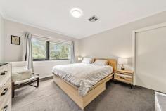  2/11 Prevost Place Macgregor ACT 2615 Nestled at the end of a quiet cul-de-sac in peaceful Macgregor is this modern and very comfortable 3 bedroom townhouse. Backing parkland, this is a rare opportunity to secure a stylish near-new home in an established suburb with all the creature comforts. The interior features a formal entryway leading through to a large open plan kitchen with walk-in pantry, dining and living room which flows out to a fabulous rear deck. The family chef will love cooking up a storm in the stunning kitchen, complete with stone benchtops, pendant lighting, and quality stainless steel appliances. Positioned on the lower level you'll also find the laundry and separate powder room. Ascending upstairs, three light and lovely bedrooms await. However, before you see the bedrooms, you are met by a spacious study. Perfect for working from home or a homework corner. All bedrooms benefit from generous sizing, built in robes and plenty of natural light. The master features its own walk-in robe & ensuite, plus great views over the park. The main bathroom, also upstairs, features a shower & bath, and a separate toilet. Also featuring a lovely outlook of the park is the elevated rear deck off the downstairs living room, which is fully covered for family meals and entertaining. Ducted reverse cycle heating and cooling, instantaneous gas hot water, and a double lock up garage with internal access add to the perks of this lovely home. The popular Magpies Belconnen Golf Club is a short drive up the road, while Kippax Centre and all its amenities are less than a 10-minute walk away. There is easy access to major arterial roads which will take you into the heart of Belconnen and the city. Features: Quiet street backing parkland Only 2 townhouses and a single house on the 1409m2 property, self-managed (low body corporate) Absolutely stunning 6-star energy efficiency rating Elevated timber patio Open plan kitchen, dining and living room Kitchen with gas cooking, stone benchtops, new dishwasher, microwave, island bench Walk in pantry Downstairs powder room Study nook on the upper level Main bedroom with walk in robe, ensuite and park views 2 additional bedrooms with built in robes Stylish main bathroom with separate toilet Laundry with good storage Ducted reverse cycle heating and cooling Fabulous elevated and covered rear deck Fully fenced rear courtyard with grassed area Double lock up garage with internal access Under stair storage NBN connected Easy access to Kippax shopping centre Close to Belconnen (9 minute drive) Less than 20 minutes to the city Walking distance to Macgregor Primary School and Kingsford Smith School 