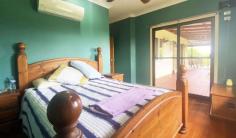  15 North Hull Road Carmoo QLD 4852 $439,000 This very attractive rural property is only an 8 minute drive (approx.) from the Mission Beach coast with 12 lush tropical islands minutes offshore, including Dunk and Bedarra Islands in Great Barrier Reef Marine Park Waters. Cairns is 2 hours away with domestic and international airport. The home is elevated and has commanding, peaceful views out over rolling lawns, rainforests and distant mountain ranges. The Mission Beach region is famous for its World Heritage Rainforest and Marine Parks and is a boating and fishing paradise. There is a boat ramp minutes away in the Hull River National Park and Clump Point Boating Harbour is at nearby Mission Beach and is a state of the art marine facility. Some features include: beautiful timber construction with polished timber floors large rural allotment of 8001m2 (2 acres) with rural residential zoning open plan lounge /living /kitchen spacious wide verandas on two sides to capture cooling breezes lounge/ living areas open directly on to the wide verandas solid timber kitchen; walk in pantry and island bench main bedroom has access directly to veranda and bathroom built-in robes; main bedroom has walk in robe split air conditioning plunge bath with spa; separate laundry internal timber doors and beautiful French doors solar panels; solar hot water system with booster 5000 L rainwater tank; town water and mains power hardwood timber framed home with Primeline cladding Colourbond 8 m x 7 m double carport plus 8 m x 7 m double lock-up roller door shed section; total 16 m x 7 m under roof garaging 6 m x 7 m freestanding 3 door Colourbond shed at entrance to the property plenty of room for caravan and boat property is partly fenced quiet rural neighbourhood 