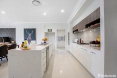  1 McArthur Close Armidale NSW 2350 $700,000 to $770,000 Presenting the masterfully designed Cosmopolitan. Located within the Foothills Estate, this stunning home boasts a plethora of living spaces and four generously sized bedrooms. At nearly 300 sq m, the scale of this home is apparent the moment you walk in the front door. The spacious open plan living area includes a gourmet kitchen with walk-in larder, family room, dining area and a TV snug, plus a separate games room and a children’s activity room. The master suite provides the ultimate luxury accommodation with a walk-in-robe, expansive ensuite, and a private courtyard oasis. If you are looking for a home that’s focus is on family living and entertaining, then this is a true dream home that will inspire you. This home is a walk in, walk out with all furniture included. 