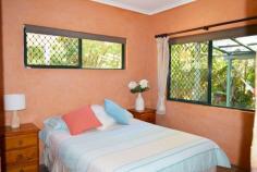  7 Hutchison Close Mission Beach QLD 4852 $389,000 This large four bedroom home is tucked away on a leafy 978m2 lot which backs onto a rainforest reserve. The home is at the end of a quiet cul-de-sac just minutes from the community aquatic centre, sporting oval and art gallery. The 14 km long beach at Mission Beach is about 1 km away. The nearby Mission Beach tourist village with restaurants cafes and shops is also nearby (1.5km). HIGHLIGHTS INCLUDE: Cool, long patios around three sides Leafy setting with lots of shade Solid cement block construction with rendered cement walls internally throughout Main bedroom has ensuite with large shower, vanity and WC Kitchen and bathroom are modern Bay window is an attractive feature in the living room Large split air-conditioner 3 m x 3 m garden shed So much outdoor undercover area for those rainy days Security screens Home adjoins Rainforest Reserve along rear boundary Mission Park Estate is a quiet leafy enclave with only residential traffic movements Realistic affordable price 