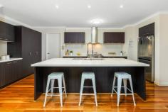  15 Palomino Ave Clyde North VIC 3978 $850,000 - $900,000 Exemplifying space and quality throughout, this Henley built home will not disappoint. Warmly welcomed by the brick and render façade and landscaped gardens, it only gets better once you step through the front door. Greeted with an extra wide hallway, spotted gum timber flooring, and the luxurious master suite to your left, this property will instantly feel like home. The master suite is ultra-spacious and features timber framed windows, a huge WIR, an enormous ensuite with separate shower, separate bath, and double his and her vanities, all making this space the ultimate parents' retreat. Continuing through the home you will notice a double door entry to your very own home office or third living space, before being presented with the heart of the home; the main living, dining and kitchen. A true chef's kitchen, boasting a 1200mm wide island with 40mm stone benchtops, 900mm oven and gas cooktop, stainless steel dishwasher, built in pantry, and plumbing to the fridge space. Surrounding the dreamy kitchen is your expansive and open plan living and dining. The living room has plenty of space for the whole family to tuck in and watch their favourite movies, while the dining space is light and airy and leads you to your alfresco via timber stacker doors. The picture perfect alfresco is perfect for year-round entertaining as the backyard features a northern aspect. With quality timber decking, blinds to keep you sheltered from the weather and grassed surrounds, it is the ideal spot for those summer BBQ's. The home also boasts a rear positioned theatre room, 3 further oversized bedrooms all with BIR's, family bathroom, powder room, a functional laundry, and an oversized double garage with rear roller door, providing an abundance of storage. Features: - Huge 1200mm kitchen island with 40mm stone benchtops - Feature timber windows and timber stacker doors - Massive 576sqm block with north facing yard - Luxurious master suite and ensuite featuring double vanities and separate bath - Spotted gum timber hardwood flooring throughout - Two distinct living zones and a study/third living - Zoned ducted heating and split system A/C to living and ensuite - Extra wide double garage with rear roller door and internal access - Alarm system and security cameras Conveniently located with Clyde Grand Reserve Playground only one house down, Selandra Rise Shopping Complex a 1-minute drive away, and Wilandra Rise Primary School and St Peter's College only an approximate 2 minutes' drive away, the lifestyle on offer doesn't get much better than this! You're also only a 3-minute walk away from the 798-bus route which takes you through to the Selandra Rise Shopping Complex, Casey Fields, Cranbourne Station, and the Cranbourne Park Shopping Centre. 