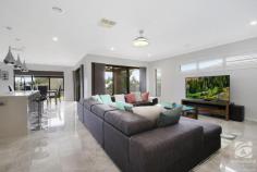  12 McAuliffe Street Wodonga VIC 3690 $789,000 This home invites you in through large double doors. Immediately the high ceilings and European porcelain tiles set the tone for high-end luxury throughout. Built by Dennis Family Homes, focusing on quality, practicality, and fixtures, this home is ideal for families of all shapes and sizes! The kitchen offers stunning waterfall stone benchtops, gas cooking, and a large butler's pantry. There are three separate living areas, the main being a central open plan kitchen, meals, and living space. Adjacent lies the family or rumpus room. This versatile space provides the opportunity and flexibility of a playroom, office, or movie room. The choice is yours! The master bedroom's grand design and layout will have you feeling like royalty. Complete with two walk-in wardrobes and an opulent ensuite featuring luxurious floor-to-ceiling European porcelain tiles, a double vanity, and a separate shower. The remaining three generous bedrooms have double robes and ceiling fans. Central to the bedrooms, the family bathroom consists of a separate shower, bath, and the same luxurious tiles featured in the ensuite and a stunning mirror surrounding the room, increasing the feeling of space. The outdoor entertaining area is accessible via the large sliding glass doors and provides a great space to relax and unwind. Positioned on a large 839 square metre block, featuring views overlooking the surrounding hills and the Albury Monument. With endless possibilities, the low-maintenance yard has plenty of scope for a large shed, pool, or the garden of your dreams. Other notable features include a 6.5kw solar system with 18 panels, irrigated yard, gas hot water and a Schweigen silent rangehood. 