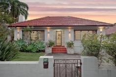  87 Kingsgrove Road Belmore NSW 2192 Ideally located on the border of Belmore and Kingsgrove, this impeccable full-brick residence delivers an instantly appealing family home, soaked in abundant light on a convenient single-level layout with an extra-wide frontage of 19.46m. Offering easy access to a choice of local schools and restaurants in Belmore, Kingsgrove and Clemton Park, just minutes to M5 access, it presents excellent value and is ready for the growing family to move straight in and enjoy. – Three (3) generous bedrooms, two with built-in wardrobes and two air-conditioners – Immaculate kitchen with Stone benchtops, 5-burner gas stove and natural skylight – Stainless steel Westinghouse appliances, dishwasher and glass splashback – Open living area with ornate fireplace, high ceilings and air-conditioner – Beautiful porcelain tiles throughout with timber floorboards in bedrooms – Separate dining room with arched bar alcove and ample natural light – Neatly landscaped front & rear yards with paved entertaining area – Fully-tiled bathroom with bathtub and separate laundry with second WC – Wide side driveway to lock-up-garage with off-street parking for 2-3 cars – Short distance to Belmore IGA, Clemton Park Coles and Kingsgrove Woolies – 5 minutes to Belmore & Kingsgrove stations, M5 access and bus connections – Close to local schools and shops in Belmore, Kingsgrove and Clemton Park 
