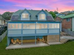  3 Cooinda Place Kiama NSW 2533 $1,250,000 - $1,350,000 Residing behind a wall of lush greenery, this uniquely built property is one to behold. Located on a quiet street only 900m from Kiama's beloved Surf Beach, this home embodies what it means to live on the south coast. The ground floor features 2 spacious bedrooms with built-in wardrobes, 1 bathroom, and a generous sized living area that flows into a well-designed kitchen. Opening from the living room you will a find well-presented indoor/outdoor entertaining area, boasting plantation shutters that offer protection from the weather or allow you to soak up the morning sun. Upstairs you will find the parents retreat with feature timber ceiling following the expansive roofline and windows allowing the evening breeze to flow through. This house offers cozy, coastal living, with ease of access to Kiama's local township, beaches, and boutique shops. This home would act well as a downsizer, holiday home, or investment property. What you will love: Private, leafy lifestyle Dual entertainment spaces 900m from Surf beach Generous parents retreat Secluded yet central location 