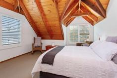  3 Cooinda Place Kiama NSW 2533 $1,250,000 - $1,350,000 Residing behind a wall of lush greenery, this uniquely built property is one to behold. Located on a quiet street only 900m from Kiama's beloved Surf Beach, this home embodies what it means to live on the south coast. The ground floor features 2 spacious bedrooms with built-in wardrobes, 1 bathroom, and a generous sized living area that flows into a well-designed kitchen. Opening from the living room you will a find well-presented indoor/outdoor entertaining area, boasting plantation shutters that offer protection from the weather or allow you to soak up the morning sun. Upstairs you will find the parents retreat with feature timber ceiling following the expansive roofline and windows allowing the evening breeze to flow through. This house offers cozy, coastal living, with ease of access to Kiama's local township, beaches, and boutique shops. This home would act well as a downsizer, holiday home, or investment property. What you will love: Private, leafy lifestyle Dual entertainment spaces 900m from Surf beach Generous parents retreat Secluded yet central location 