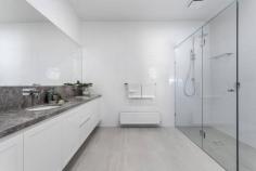  79 Bay Rd Sandringham VIC 3191 $2,950,000 - $3,150,000 Almost brand new, this beautiful 4 bedroom + study, 3.5 bathroom Hamptons inspired family residence impresses with its high ceilings, engineered oak floors, plantation shutters, double glazed windows and doors. Featuring an elegant lounge, a magnificent north facing living and dining area, a sublime marble kitchen (Miele appliances and spacious WI pantry), separate wine room and upstairs retreat, a deep north facing rear garden with large alfresco terrace, quality landscaping, extra large double auto garage with added workspace, extra parking and auto driveway gate. - 3 entertaining zones + covered terrace with BBQ kitchen - Amazing marble kitchen with Miele appliances and WI pantry - Hydronic heating + zoned ducted R/C air conditioning - Quality window furnishings and flyscreens throughout - Abundant quality storage cabinetry with soft-close - Video intercom, alarm, CCTV security and auto driveway gate - NBN, in-house data hub and cabling. Ducted vacuum - Huge north facing rear garden with auto irrigation and water tank - Walk to great local primary, secondary and private schools - Stroll to Sandringham village, cafes, train and beaches 