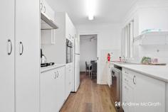  15 Lindeman Cl Eleebana NSW 2282 $950,000-$1,045,000 How many times have you wished for more entertaining space ... or that the kids had somewhere to play in bad weather? Have you been looking for a family home that offers ... MORE ... then look no further. Let's start with the location, because that too is a drawcard! This feature packed, single level brick home is located within 350 metres of Eleebana Childrens Centre, 1.5kms from Eleebana Public School and less than 3 kms from Warners Bay and Mount Hutton Shopping Centres - and is just a short drive from the shores of Lake Macquarie! The slightly sloped block is on the high side of prestigeous Lindeman Close, and has a parking pad tucked in the front corner, perfect for the boat or van ... or your teenagers car! For those catching the bus, the bus stop in Glad Gunson Drive is under 250 metres walk. Now, let's take you inside ... every inch of this floorplan is useful and every room is both modern and practical. The formal entry space even has a perfectly positioned closet - ideal for coats, umbrellas and for kicking off your shoes! The entry leads straight to the L-shaped formal living and dining space with the modern kitchen positioned right in the heart of the home. The kitchen will please the most avid chef with a dishwasher, natural gas cooktop and wall oven and overlooks the rear informal meals and living areas. Just beyond is a beautiful alfresco area with another covered versatile entertaining space, play room or man cave. Freshly painted throughout with new floating floors to the living areas, the formal living and dining area feature a split system reverse cycle air conditioner. There are two good-sized bedrooms at the front of the home, both have built-in wardrobes, the main features an ultra modern ensuite. The other two bedrooms are generous, both with built-in robes and are positioned near the stunning modern bathroom with floor-to-ceiling dark tiles and a modern claw foot bath. The attached double garage opens to the alfresco area, providing cover for anyone returning home .. and it's just a few steps from the kitchen, so you won't have to lug heavy groceries too far! 
