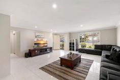  21 Coral Fern Way Gwandalan NSW 2259 $940,000 - $990,000 Judging a book by its cover would certainly be a mistake here as this exceptional property, offering the ultimate lifestyle and modern comforts with space for the whole family to relax and enjoy, is now available for you to capture. Be impressed as you enter this very spacious abode boasting a large and free flowing floorplan designed for modern living and easy entertaining. Four generous size bedrooms with built-ins in all, ensuite and walk-in robe to main will have everyone tucked away in comfort and space. The centrally located and modernised kitchen with ample cabinetry and granite benchtops is ideal for family gatherings and parties. Seamlessly flowing from inside to out, the large and private undercover entertaining area is complete with ample space for the BBQ and wall mounted T.V bracket to catch those all-important sporting events while cooking up a storm. Extras include, double gated side access for off street parking for both the caravan and the boat, solar panels, 3 x split cycle air conditioning units & manicured gardens. Situated in the sought after suburb of Gwandalan, with the largest salt water lake in the southern hemisphere just down the road, the whole family will have the opportunity to enjoy the sort of "weekend lifestyle" you've always wished for, only here, you can live it every day of the week! Features: Approximate 23.8 meter frontage with off street parking for caravan & boat. 3 x split system air conditioning units. Internal and external living areas combined - 305sqm approximately. Land size - 748sqm approximately. Solar panels Manicured gardens with ample room for pets. 