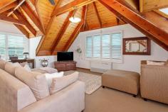  3 Cooinda Place Kiama NSW 2533 $1,250,000 - $1,350,000 Residing behind a wall of lush greenery, this uniquely built property is one to behold. Located on a quiet street only 900m from Kiama's beloved Surf Beach, this home embodies what it means to live on the south coast. The ground floor features 2 spacious bedrooms with built-in wardrobes, 1 bathroom, and a generous sized living area that flows into a well-designed kitchen. Opening from the living room you will a find well-presented indoor/outdoor entertaining area, boasting plantation shutters that offer protection from the weather or allow you to soak up the morning sun. Upstairs you will find the parents retreat with feature timber ceiling following the expansive roofline and windows allowing the evening breeze to flow through. This house offers cozy, coastal living, with ease of access to Kiama's local township, beaches, and boutique shops. This home would act well as a downsizer, holiday home, or investment property. What you will love: Private, leafy lifestyle Dual entertainment spaces 900m from Surf beach Generous parents retreat Secluded yet central location 