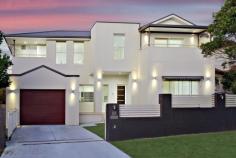  23 Eleanor Avenue Belmore NSW 2192 This flawless two-storey grand family residence is the ultimate statement in modern living. Perfectly located in a quiet, tree-lined cul-de-sac with easy access to transport and shops, it offers a contemporary family haven with an inviting poolside entertaining deck and elevated city views from the second level. Distinguished by spacious proportions, bright interiors and a tasteful neutral colour palette, this superb residence delivers a luxurious family oasis, all on an extra wide frontage of 16.76m. – Six (6) substantial bedrooms with built-in robes and 3 with private balconies – Extra-large master with en-suite, walk-in wardrobe & delightful city views from private balcony – Additional studio room with en-suite, currently utilised as poolside gymnasium – Modern kitchen with stainless steel appliances, dishwasher & ample bench space – Sunlit open living and dining areas with seamless indoor/outdoor flow – Undercover alfresco entertaining deck overlooking in-ground swimming pool & manicured lawns – 4 spacious, fully-tiled bathrooms with two bath tubs and separate showers – Remote lock up garage with internal access, storage plus additional front car spot – 5 mins to Belmore village shops, train station, parks and local schools – Footsteps to All Saints Grammar, Clemton Park Coles and Belmore IGA Additional Features: Electronic security gates, laundry room, storage room, linen cupboards, security system with intercom, multiple air-conditioning units, shutter blinds, reverse cycle ducted air-conditioning, timber floorboards, carpet and tiles. 