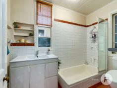  36 Willis St Tarragindi QLD 4121 A celebration of old-world elegance, this dual-level worker’s cottage with tasteful updates is set amongst verdant greenspace. Translating to ‘beautiful’ in the indigenous Yorta Yorta language, the aptly-named ‘Kalimna’ invites you to enjoy a truly fantastic lifestyle. Benefitting from having just one neighbour, the home was originally moved from Kangaroo Point to be positioned in a family-friendly enclave. The property includes: - Grand character façade complemented by ornate fretwork, a covered front verandah and picket-fenced front gardens - Traditional pine floors upstairs and engineered bamboo floors downstairs, as well as lofty ceilings, VJ walls, casement windows and ceiling roses throughout - Generous living area and an adjoining study nook upstairs - Connecting dining room, plus a tidy kitchen displaying a tiled splashback and ample cupboard storage - Large covered rear deck looking out to a lush canopy - Second living area or rumpus room downstairs; the ground level was renovated by Sovereign Homes - Covered rear terrace leading to a fully-fenced artificially-turfed rear yard showcasing mature gardens - Two sizeable bedrooms upstairs and a well-appointed full bathroom - Another two bedrooms downstairs fitted with built-in robes - Second full bathroom and a separate laundry boasting rear terrace access - Off-street parking for one car - Air-conditioning, ceiling fans, a solar power system, security screens and superb storage Only six kilometres from Brisbane’s CBD, this exceptional residence is close to a multitude of shops and dining options. Stones Corner’s attractions, the South East Busway and Greenslopes Private Hospital are also nearby. Falling within the Junction Park State School and Yeronga State High School catchment area, this brilliant home is also a short drive from Saint James Catholic Primary School, Our Lady of Mount Carmel Primary School and Loreto College. 