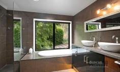  8 Harnett Ln Mittagong NSW 2575 $2,450,000 - $2,495,000 Positioned in Mittagong's exclusive blue-ribbon pocket, Mount Gibraltar. Boasting a whisper quiet setting on just over an acre of lush mountain surrounds, this magnificent residence redefines the meaning of a family sanctuary. Spanning two incredibly spacious levels, striking contemporary interiors are flawless in both their presentation and functionality, providing everything modern families require with ease. Though tempting to simply hide away from the world here, the home’s capacity for entertaining is fabulous and with a setting as idyllic as this one, sharing it with those you love will create many wonderful memories to treasure. 14kw ducted heating and cooling system ⎜Wood fireplace ⎜Ceiling fans Formal lounge ⎜Formal dining ⎜Living room ⎜Home theatre Home office ⎜Upstairs sitting area Bespoke European made kitchen with island bench ⎜Breakfast room 900mm Smeg gas cooktop ⎜Dual Smeg wall ovens ⎜ Smeg undermount sink Caesarstone bench tops and splashback ⎜Hybrid laminate floors Woollen carpet ⎜Built-in wardrobes in four bedrooms Master retreat with walk-in robe, ensuite and views Twin vanities in bathrooms ⎜Rain-shower heads ⎜Electric heated towel rails Spa bath in ensuite ⎜Guest powder room Expansive composite wraparound entertaining terrace Double electric garage ⎜Driveway parking Extensive storage ⎜Large laundry Wired for connectivity throughout 
