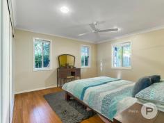  36 Willis St Tarragindi QLD 4121 A celebration of old-world elegance, this dual-level worker’s cottage with tasteful updates is set amongst verdant greenspace. Translating to ‘beautiful’ in the indigenous Yorta Yorta language, the aptly-named ‘Kalimna’ invites you to enjoy a truly fantastic lifestyle. Benefitting from having just one neighbour, the home was originally moved from Kangaroo Point to be positioned in a family-friendly enclave. The property includes: - Grand character façade complemented by ornate fretwork, a covered front verandah and picket-fenced front gardens - Traditional pine floors upstairs and engineered bamboo floors downstairs, as well as lofty ceilings, VJ walls, casement windows and ceiling roses throughout - Generous living area and an adjoining study nook upstairs - Connecting dining room, plus a tidy kitchen displaying a tiled splashback and ample cupboard storage - Large covered rear deck looking out to a lush canopy - Second living area or rumpus room downstairs; the ground level was renovated by Sovereign Homes - Covered rear terrace leading to a fully-fenced artificially-turfed rear yard showcasing mature gardens - Two sizeable bedrooms upstairs and a well-appointed full bathroom - Another two bedrooms downstairs fitted with built-in robes - Second full bathroom and a separate laundry boasting rear terrace access - Off-street parking for one car - Air-conditioning, ceiling fans, a solar power system, security screens and superb storage Only six kilometres from Brisbane’s CBD, this exceptional residence is close to a multitude of shops and dining options. Stones Corner’s attractions, the South East Busway and Greenslopes Private Hospital are also nearby. Falling within the Junction Park State School and Yeronga State High School catchment area, this brilliant home is also a short drive from Saint James Catholic Primary School, Our Lady of Mount Carmel Primary School and Loreto College. 