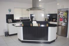 77 Canecutters Drive Ooralea QLD 4740 Beautiful on the outside, brilliant on the inside, this 4 bedroom, 2 bathroom home has it all. Fully air-conditioned with fans. The main bedroom has a 'his and her' walk in wardrobe that leads into a well appointed en-suite, it's air conditioned and carpeted. The other bedrooms are a good size and have built in wardrobes, air conditioned, and carpeted. The modern kitchen and dining area is open plan and tiled for easy cleaning and leads onto a undercover patio and entertainment area. The property is on a corner block, has a double automatic lock up garage and is protected with security screens. The easy access 6m x 6m double bay lock up shed is powered. There's plenty of room to park a caravan or boat. This well appointed home is situated within walking distance to shops, and close to the CQ University and Paget. 