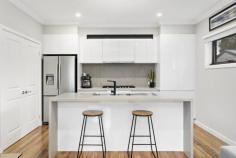  21 Dublin Rd Ringwood East VIC 3135 $870,000 - $950,000 The perfect presentation for an easy lifestyle, and the perfect position being a few short minutes to Eastland and Ringwood East shops and the train stations, and to Ringwood Secondary College and Great Ryrie Primary School. Aquinas College and Aquanation pool and gym are also close by. A modern townhouse offering street frontage, a comfortable and current open plan living design on the ground floor, a second living room upstairs, three bedrooms with mirrored built in robes, two bathrooms and a powder room. Live and entertain in style with a kitchen that is easy on the eye and extremely well appointed with a stone waterfall island bench top and Westinghouse stainless steel appliances, with the addition of an outdoor deck and a landscaped backyard which offers a water tank and access into the garage. Further highlights include ducted heating, x2 split system AC's, hardwood floors and modern window furnishings. 