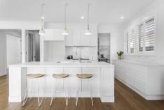  79 Bay Rd Sandringham VIC 3191 $2,950,000 - $3,150,000 Almost brand new, this beautiful 4 bedroom + study, 3.5 bathroom Hamptons inspired family residence impresses with its high ceilings, engineered oak floors, plantation shutters, double glazed windows and doors. Featuring an elegant lounge, a magnificent north facing living and dining area, a sublime marble kitchen (Miele appliances and spacious WI pantry), separate wine room and upstairs retreat, a deep north facing rear garden with large alfresco terrace, quality landscaping, extra large double auto garage with added workspace, extra parking and auto driveway gate. - 3 entertaining zones + covered terrace with BBQ kitchen - Amazing marble kitchen with Miele appliances and WI pantry - Hydronic heating + zoned ducted R/C air conditioning - Quality window furnishings and flyscreens throughout - Abundant quality storage cabinetry with soft-close - Video intercom, alarm, CCTV security and auto driveway gate - NBN, in-house data hub and cabling. Ducted vacuum - Huge north facing rear garden with auto irrigation and water tank - Walk to great local primary, secondary and private schools - Stroll to Sandringham village, cafes, train and beaches 