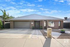  12 McAuliffe Street Wodonga VIC 3690 $789,000 This home invites you in through large double doors. Immediately the high ceilings and European porcelain tiles set the tone for high-end luxury throughout. Built by Dennis Family Homes, focusing on quality, practicality, and fixtures, this home is ideal for families of all shapes and sizes! The kitchen offers stunning waterfall stone benchtops, gas cooking, and a large butler's pantry. There are three separate living areas, the main being a central open plan kitchen, meals, and living space. Adjacent lies the family or rumpus room. This versatile space provides the opportunity and flexibility of a playroom, office, or movie room. The choice is yours! The master bedroom's grand design and layout will have you feeling like royalty. Complete with two walk-in wardrobes and an opulent ensuite featuring luxurious floor-to-ceiling European porcelain tiles, a double vanity, and a separate shower. The remaining three generous bedrooms have double robes and ceiling fans. Central to the bedrooms, the family bathroom consists of a separate shower, bath, and the same luxurious tiles featured in the ensuite and a stunning mirror surrounding the room, increasing the feeling of space. The outdoor entertaining area is accessible via the large sliding glass doors and provides a great space to relax and unwind. Positioned on a large 839 square metre block, featuring views overlooking the surrounding hills and the Albury Monument. With endless possibilities, the low-maintenance yard has plenty of scope for a large shed, pool, or the garden of your dreams. Other notable features include a 6.5kw solar system with 18 panels, irrigated yard, gas hot water and a Schweigen silent rangehood. 