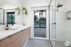  8 Quinns Lane Magpie VIC 3352 $1,050,000-$1,150,000 All the work has been done on this beautiful 4-bedroom lifestyle property on 4,704m2 (approx), close to Buninyong and a short drive to Ballarat CBD. The expansive Living room with adjacent Recreation room is light filled on both ends and has it's own split system and direct access to the rear yard. Close-by on the north side of the home is the Master Bedroom which has a WIR and a BIR, plus a new ensuite with floor-to-ceiling tiles, shower, vanity & toilet. The other 3 bedrooms flank the west side of the home, two of them with BIRs and the other has a WIR. All bedrooms have updated carpet underfoot. Nearby is a new bathroom, complete with freestanding egg-shape bath, vanity & large shower, finished with black hardware. There is a new separate toilet next door. The open-plan Family/Dining/Kitchen area is simply beautiful and a great space to entertain, offering direct access through two glass sliding doors to the front verandah and undercover Patio. Along with the rest of the home, this area enjoys ducted gas central heating and evaporative cooling, though it can be closed off by utilizing it's own split system unit and a large Norseman wood fire. The Kitchen benches, along with those in the Bathrooms and Laundry are topped with "Gold Calcutta" stone. There is a Bocchi butler's sink, a quality Asko dishwasher and a 900mm Westinghouse duel fuel upright cooker. The updated Laundry is close by and has underbench and overhead storage & direct access to the side yard and clothesline. New timber laminate flooring has been installed to all living spaces, including the Kitchen & Laundry. Under the roofline is a double garage with direct home access and remote door. Plenty of additional parking is available out front also. The other key feature of this property is the 18m x 8m shed which has power, concrete flooring, insulated walls plus camera & alarm security. This would make a great workshop, "toy storage" and/or entertainment "cave". 