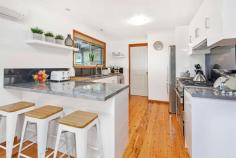  3 Cooinda Place Kiama NSW 2533 $1,250,000 - $1,350,000 Residing behind a wall of lush greenery, this uniquely built property is one to behold. Located on a quiet street only 900m from Kiama's beloved Surf Beach, this home embodies what it means to live on the south coast. The ground floor features 2 spacious bedrooms with built-in wardrobes, 1 bathroom, and a generous sized living area that flows into a well-designed kitchen. Opening from the living room you will a find well-presented indoor/outdoor entertaining area, boasting plantation shutters that offer protection from the weather or allow you to soak up the morning sun. Upstairs you will find the parents retreat with feature timber ceiling following the expansive roofline and windows allowing the evening breeze to flow through. This house offers cozy, coastal living, with ease of access to Kiama's local township, beaches, and boutique shops. This home would act well as a downsizer, holiday home, or investment property. What you will love: Private, leafy lifestyle Dual entertainment spaces 900m from Surf beach Generous parents retreat Secluded yet central location 