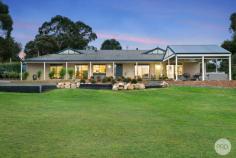  8 Quinns Lane Magpie VIC 3352 $1,050,000-$1,150,000 All the work has been done on this beautiful 4-bedroom lifestyle property on 4,704m2 (approx), close to Buninyong and a short drive to Ballarat CBD. The expansive Living room with adjacent Recreation room is light filled on both ends and has it's own split system and direct access to the rear yard. Close-by on the north side of the home is the Master Bedroom which has a WIR and a BIR, plus a new ensuite with floor-to-ceiling tiles, shower, vanity & toilet. The other 3 bedrooms flank the west side of the home, two of them with BIRs and the other has a WIR. All bedrooms have updated carpet underfoot. Nearby is a new bathroom, complete with freestanding egg-shape bath, vanity & large shower, finished with black hardware. There is a new separate toilet next door. The open-plan Family/Dining/Kitchen area is simply beautiful and a great space to entertain, offering direct access through two glass sliding doors to the front verandah and undercover Patio. Along with the rest of the home, this area enjoys ducted gas central heating and evaporative cooling, though it can be closed off by utilizing it's own split system unit and a large Norseman wood fire. The Kitchen benches, along with those in the Bathrooms and Laundry are topped with "Gold Calcutta" stone. There is a Bocchi butler's sink, a quality Asko dishwasher and a 900mm Westinghouse duel fuel upright cooker. The updated Laundry is close by and has underbench and overhead storage & direct access to the side yard and clothesline. New timber laminate flooring has been installed to all living spaces, including the Kitchen & Laundry. Under the roofline is a double garage with direct home access and remote door. Plenty of additional parking is available out front also. The other key feature of this property is the 18m x 8m shed which has power, concrete flooring, insulated walls plus camera & alarm security. This would make a great workshop, "toy storage" and/or entertainment "cave". 