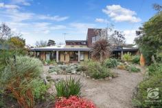  7 Drew Court Beechworth VIC 3747 $780,000 to $810,000 This architecturally designed mud-brick home is quietly tucked away and is surrounded by colourful native gardens. Wide verandahs invite you into this special home. The spacious living and dining area feature polished slate floors, soaring timber ceilings and solid exposed beams. Large windows and French doors allow the outside in. An attractive Coonara-style wood fire is a focal point, whilst there is hydronic floor heating to maintain a constant, comfortable temperature through winter. Wooden and mud-brick walls co-exist with native timber cabinetry and benchtops bringing character to the well-equipped kitchen, complete with a walk-in pantry, electric cooking and dishwasher. A second living and dining with skylights can be sectioned off from the main living room. The generous master bedroom has large built-in robes and accesses a beautifully styled ensuite with shower and vanity. An equally spacious second bedroom has large built-in robes, and like the master, is drenched in morning sunlight. A two-way toilet is accessed from either the ensuite or the family bathroom. This second bathroom features a shower, small bath and timber vanity. The large laundry, doubling as a utility/mud-room has plenty of storage - there is no shortage of storage options in this home! A wide craftsman-built Jarrah staircase ushers you to the upper floor. Quietly situated here is the third bedroom. Complete with its own toilet and vanity, this is a truly special place with a private deck. You will spend many hours here amongst the treetops and above the rooftops. Outside a secure shed will house your garden implements, the bird-attracting native gardens are beautifully established whilst there is plenty of space for vegetables. 