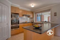  33 Oaklands Way Pakenham VIC 3810  $700,000 - $770,000 Timeless in style and beautifully presented this family home, neatly tucked away in a prime pocket of Lakeside is perfect for all buyers who have been searching for a trustworthy, forever home. Sitting on a large 694sqm corner allotment with immediate street appeal this versatile floorplan offers that can be configured to a multitude of requirements. The master suite offers a dressing room and ensuite featuring a double shower and corner spa. Two more bedrooms at the rear of the home feature built-in robes serviced by a family bathroom and a separate toilet. Further emphasizing its fine family credentials is a large front formal lounge, well-appointed kitchen with adjoining living/dining area, plus the added bonus of an additional rumpus/theatre room (optional 4th bedroom). Completing the picture is a huge covered outdoor entertaining area that overlooks the manicured rear lawn and border gardens Add a remote-control double garage with drive-thru access, additional side access for the boat/caravan, solar panels, water tank and two sheds. Close by to local shopping, schools, public transport and some of Pakenham’s best amenities, this one won't hang around for long. 