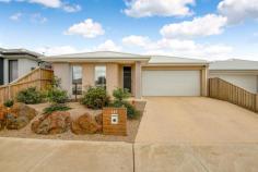  147 Merrijig Dr Torquay VIC 3228 $975,000 With a light, bright aesthetic and beautifully landscaped low maintenance gardens, this near-new home provides all the luxuries of convenient coastal living. The 4 carpeted bedrooms are all generous in size with the master featuring tinted windows for added privacy, large walk-in-robe & en-suite whilst the other 3 bedrooms all showcase spacious built-in-robes.  The open plan meals & living space at the rear of the property is flooded with beautiful afternoon sun and opens up onto the perfect outdoor entertaining area for year-round enjoyment and space for the kids. The kitchen is complete with 900mm appliances, dishwasher, large pantry and plenty of bench and cupboard space ticking all the boxes for your family and culinary needs. With the added feature of a second living space perfect for a kids' retreat (or adults-alike), formal sitting area or home office.  The central bathroom provides bath with separate shower and adjoining separate toilet whilst the laundry is well equipped with external access. This immaculately kept home is temperature-controlled year-round with gas ducted heating, split system in the living space plus ceiling fans throughout. The double garage offers plenty of space for safe and secure storage. All situated in the perfect location, just a skip hop & jump to The Beach, The Dune's Village, Torquay Coast Primary & Lisieux Catholic Primary, Surf Coast Secondary College, Sporting facilities & Torquay Farmers Market. 