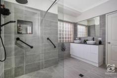  50 Banksia Street West Albury NSW 2640 $769,000 This lovely home has so much to offer. On a big block of 1227m2, with an additional two-car garage/workshop in the back yard, there is room for the whole family. Beautifully landscaped and cared for, there is ample room for entertaining adults and children alike in the spacious backyard. Plenty of room to run and separate garden areas provide interest and fun for all. From its lofty vantage point, the fully renovated kitchen with stone benchtops overlooks the town below. Wood flooring in all the living areas provides character and charm that will not go unnoticed by guests. The split-level design adds interest and separation between the living zones, so parents and children can have quiet enjoyment of their chosen pastimes. Having the large master retreat at one end of the home and the children's bedrooms at the other again adds to the flow and practicality of this home. Completing the master suite is a beautifully renovated ensuite with a walk-in shower and a spacious walk-in robe. Other notable features include: - Ducted heating and cooling plus a split system - 6x8 powered workshop plus a garden shed - 6.5kw solar system - Gas hot water service - Covered, paved alfresco area - Ducted vacuuming unit - Automatic irrigation system in the front and rear yard 
