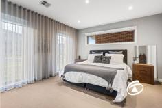  3 Graziers Cres Clyde North VIC 3978 $1,250,000 - $1,300,000 An exceptional Porter Davis build with an offering of uncompromising space, style and quality, this beautifully appointed 5-bedroom residence has been expertly crafted to cater to all stages of family living boasting 42sq URL on a 448m2 Lot. A model of modern sophistication with an emphasis on family functionality, the home offers the choice of 2 main bedrooms upstairs and downstairs. Featuring living areas on both levels – including a ground floor entertaining zone, a dedicated media room plus an enviable rumpus overlooking an enclosed alfresco setting complete with outdoor built-in seating and wall mounted bar counter. At the heart of the home, the stunning kitchen is anchored by an exquisite waterfall edge island and showcasing premium appliances along with a full butler’s pantry, laundry with drying racks, and plenty of storage. Additionally, three beautifully appointed bathrooms, a guest powder room and linen press complete the extras. Upstairs features the second master bedroom with an en-suite, WIR, private balcony and a kids retreat with an adjoining study all completed with a desk and returns. The remaining three bedrooms are serviced by a family bathroom & separate toilet. With a host of inclusions, only a visit will uncover, zoned heating/cooling, ducted vacuum, engineered floors, square set cornices, alarm system and a large (7.5 x 6.1) double garage with internal access. Low maintenance & with an abundance of space, the home is just moments to quality schools and major amenities. 