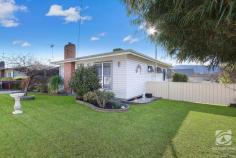  6 Womaatong Street Tallangatta VIC 3700 Tightly held is thrown around a lot in real estate, but Tallangatta really is the definition. Running alongside the high-country rail trail, this beautiful home is the ideal location for those looking to downsize, break into the market or have a nice place to get away for the weekend. Comprising of two oversized bedrooms with large windows capturing copious amounts of natural light, creating a bright and relaxed atmosphere. Central to the bedrooms, the bathrooms offer separate entrances from each room with a modern feel and layout featuring a separate shower and vanity. The homes living area is a cosy place, inviting you to sit back and relax, central to the living room, the wood heater creates a warm feel and looks second to none, with the added bonus of both ducted cooling and split system ensuring you stay comfortable all year round. The kitchen is contemporary, featuring an expansive bench space, loads of storage, a walk-in pantry and gas cooking, it is the perfect place for cooks and chiefs of all levels to cook up a storm for the entire family. The yard is a beautiful oasis, the large entertaining deck giving you panoramic views of the surrounding hills and all the beauty that Tallangatta has to offer. Other notable features include a 6x4 shed, multiple vehicle storage and established fruit trees. 