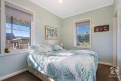  6 Womaatong Street Tallangatta VIC 3700 Tightly held is thrown around a lot in real estate, but Tallangatta really is the definition. Running alongside the high-country rail trail, this beautiful home is the ideal location for those looking to downsize, break into the market or have a nice place to get away for the weekend. Comprising of two oversized bedrooms with large windows capturing copious amounts of natural light, creating a bright and relaxed atmosphere. Central to the bedrooms, the bathrooms offer separate entrances from each room with a modern feel and layout featuring a separate shower and vanity. The homes living area is a cosy place, inviting you to sit back and relax, central to the living room, the wood heater creates a warm feel and looks second to none, with the added bonus of both ducted cooling and split system ensuring you stay comfortable all year round. The kitchen is contemporary, featuring an expansive bench space, loads of storage, a walk-in pantry and gas cooking, it is the perfect place for cooks and chiefs of all levels to cook up a storm for the entire family. The yard is a beautiful oasis, the large entertaining deck giving you panoramic views of the surrounding hills and all the beauty that Tallangatta has to offer. Other notable features include a 6x4 shed, multiple vehicle storage and established fruit trees. 