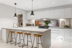  3 Graziers Cres Clyde North VIC 3978 $1,250,000 - $1,300,000 An exceptional Porter Davis build with an offering of uncompromising space, style and quality, this beautifully appointed 5-bedroom residence has been expertly crafted to cater to all stages of family living boasting 42sq URL on a 448m2 Lot. A model of modern sophistication with an emphasis on family functionality, the home offers the choice of 2 main bedrooms upstairs and downstairs. Featuring living areas on both levels – including a ground floor entertaining zone, a dedicated media room plus an enviable rumpus overlooking an enclosed alfresco setting complete with outdoor built-in seating and wall mounted bar counter. At the heart of the home, the stunning kitchen is anchored by an exquisite waterfall edge island and showcasing premium appliances along with a full butler’s pantry, laundry with drying racks, and plenty of storage. Additionally, three beautifully appointed bathrooms, a guest powder room and linen press complete the extras. Upstairs features the second master bedroom with an en-suite, WIR, private balcony and a kids retreat with an adjoining study all completed with a desk and returns. The remaining three bedrooms are serviced by a family bathroom & separate toilet. With a host of inclusions, only a visit will uncover, zoned heating/cooling, ducted vacuum, engineered floors, square set cornices, alarm system and a large (7.5 x 6.1) double garage with internal access. Low maintenance & with an abundance of space, the home is just moments to quality schools and major amenities. 