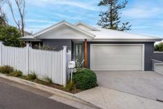  10 Tuckerman Lane Coledale NSW 2515 This contemporary and low maintenance home is guaranteed to impress!!! The features, quality and location offer a lifestyle that is second to none. It truly is a 'must inspect'. HOME: * The home has been thoughtfully designed and masterfully constructed leaving you with nothing else to do but move straight in and begin enjoying the amazing lifestyle that Coledale offers. * This is a genuine low maintenance home that has been designed with majority single level living, making it an ideal choice for families, downsizers and anyone wanting to spend more time enjoying the natural surroundings and less time on property upkeep. * In addition to the open plan living, dining, kitchen area, the home also features a second sitting room which is ideal as a rumpus, media room, kids play area or home office. * The living area flows seamlessly onto a North facing outdoor entertaining area which boasts an appealing ocean outlook. This is the perfect setting for entertaining friends, alfresco dining with the family or simply relaxing in the sun and enjoying the view. * The compact backyard is fully fenced and suited for those with pets or to use as a peaceful garden space. * High 10ft ceilings and large windows allow for plenty of natural light throughout and give the home a genuine feeling of space. * Ducted reverse cycle air-conditioning keeps you comfortable all year around however you may not need it during summer with those cool ocean breezes coming in from the East * Main bedroom features a walk-in robe and large ensuite. * Remote double garage with internal access.. LOCATION & LIFESTYLE: Only steps from Coledale Beach, the rockpool, fantastic cafes, parks, schools, shops and 15 minutes walk along the beach to the popular Headlands Pub. Situated on a quiet laneway. Ideal for commuting with the bus stop and train station only moments from your front door. Coledale is a charming and peaceful coastal suburb, approximately 1 hour South of Sydney CBD and approximately 30 minutes North of Wollongong CBD. Embrace coastal living with swimming, fishing, bushwalking and picnics in popular parklands all available only moments from your doorstep. 