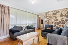  72 Bluehills Rd O'Halloran Hill SA 5158 $575,000-$595,000 Neighbouring the Happy Valley Reservoir and expansive Serpentine Road Reserve with sports clubs and skate ramp, this tidy ’60’s home sitting on 716sqms (approx.) has been lovingly cared for and upgraded. Currently leased to excellent tenants at $380 per week, it will make a sound portfolio addition if you’re after an investment. Polished timber floors line a generous entry and large formal lounge with enormous picture windows allowing for maximum natural light, while a gorgeous stone feature wall is made extra special by the addition of a Nectre slow combustion heater. A sliding door opens onto a renovated white kitchen with plenty of cupboard and bench space, gas cooktop, dishwasher and walk-in pantry, before an adjoining formal dining space overlooks the backyard. Offering infinite space for little legs or furry friends, a large paved area meets raised garden beds full of easy-care greenery before steps lead up to plenty of lawn completing the family friendly backyard. Three sizeable bedrooms are each serviced by the updated central bathroom with shower, bath and convenient separate w/c, while a bonus detached theatre room with split system air conditioner within the rear shed can be put to whatever use you’d like. The finer details: – Ducted evaporative cooling – Solar panels – Carport with roller door & drive-through access + off-street parking – Additional shedding/storage – Separate laundry with outside access Close to local shops, parks, schools and the beach, and less than 20kms from the CBD, there is something for everyone to love about the location. 