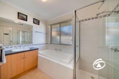  33 Oaklands Way Pakenham VIC 3810  $700,000 - $770,000 Timeless in style and beautifully presented this family home, neatly tucked away in a prime pocket of Lakeside is perfect for all buyers who have been searching for a trustworthy, forever home. Sitting on a large 694sqm corner allotment with immediate street appeal this versatile floorplan offers that can be configured to a multitude of requirements. The master suite offers a dressing room and ensuite featuring a double shower and corner spa. Two more bedrooms at the rear of the home feature built-in robes serviced by a family bathroom and a separate toilet. Further emphasizing its fine family credentials is a large front formal lounge, well-appointed kitchen with adjoining living/dining area, plus the added bonus of an additional rumpus/theatre room (optional 4th bedroom). Completing the picture is a huge covered outdoor entertaining area that overlooks the manicured rear lawn and border gardens Add a remote-control double garage with drive-thru access, additional side access for the boat/caravan, solar panels, water tank and two sheds. Close by to local shopping, schools, public transport and some of Pakenham’s best amenities, this one won't hang around for long. 