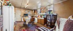  21 Bank St Cobargo NSW 2550 $399,000 "Laramie" - Quaint old style family home on a large 1214 m2 block of land in Cobargo. Homes in this low price range are getting harder to find as more are renovated or removed to build bigger modern homes. This home is in original condition, feels warm and inviting with a friendly vibe of visiting your grandparents many years ago. Features: Glassed in sun room at the entry, open plan lounge dining and kitchen all in one, two bedrooms, study area, large storage/craft room (aka "the pantry"), external laundry with shower and toilet. There is a new slow combustion wood heater which warms the home in winter as well as heating your hot water and allows you to cook on it also and open fire place that the current owners have closed off but easy to get it up and firing again. Outside: The 1214 m2 block of land has a gentle slope, good soil for gardening, two carports (one with a garden/tool shed), large shade trees, numerous cottage style gardens and an abundance of varied established fruit trees. Location: Short walk to Narira Creek (at the bottom of the street), swimming pool, main shopping area, Cobargo Hotel, sporting fields, showground and primary school. A twenty minute drive south takes you to Bega, or head east to Bermagui and its pristine beaches, amazing mountain views, boat ramps and many fine eating venues. Cobargo is a small town with a great friendly community. Markets are held each Saturday in the main street which attracts a lot of visitors and has the The Cobargo Folk Festival in May each year bringing performers together from all over the country. 