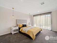  22 Nicholii Loop Jerrabomberra NSW 2619 Located in a sought-after dress circle location of Jerrabomberra you will find this impressive five bedroom residence that is perfect for a multi-generational family or those with independent living requirements. Upon entering through the double-glass doors you will instantly admire the scale and proportion this property offers. Featuring a grand formal lounge and dining room which offers space for the largest of lounges and offers a balcony with stunning city views. The large open plan kitchen and family room offers access out to its own balcony, again with stunning views. From the family room you also have access to the private outdoor entertaining area. The kitchen boasts a 900mm oven and gas cooktop, large island bench and excellent storage. On this level you will find the segregated master suite which features a walk-in robe and ensuite. Up half a level is home to three additional king-sized bedrooms each with built-in robes. On this level you will also find the family bathroom, laundry and large walk-in linen cupboard. On the ground level you will find the fully self-contained one bedroom flat. This all-inclusive space features its own entrance and courtyard. The flat comes complete with a light-filled open plan lounge, dining and kitchen area. There is a large bedroom with built-in robes, a full bathroom and its own laundry. On the ground level is the oversized double garage with internal access and remote roller doors. Storage won’t be an issue with the bonus of additional under house storage. The property boasts ducted reverse cycle air conditioning to the upper levels and a reverse cycle air conditioner for the ground level. The installation of 6.6kws of solar will help to keep your energy bills down. At the front you will find impressive off-street parking options thanks to the large circular driveway, additional parking spaces as well as the verge parking located along the street. All of the gardens are easy-care and feature automatic irrigation system and a level lawn area for children or pets to enjoy. Features: – Grand formal lounge and dining room – Open plan kitchen and family room – Fully self-contained flat on ground level with amenities – Segregated master suite with walk-in robe and ensuite – Remaining bedrooms all large with built-in robes – Ducted reverse cycle air conditioning – 6.6kw of solar – Ducted vacuuming – Balconies and large entertaining area with views – Double garage with internal access and remote doors – Easy care gardens with automated irrigation – Large circular driveway and excellent off-street parking – Dress circle location surrounded by quality homes 