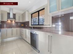  1 Markham St Holsworthy NSW 2173 $1,300,000 - $1,350,000 This well presented light-filled home offers a practical floor plan and is low maintenance, perfect for young families. Located in a peaceful central location directly opposite local parkland within close proximity to schools & 10 minutes walking distance to shops and public transport. Notable Features: • Boasting 4 double sized bedrooms plus downstairs study or possible 5th bedroom • All bedrooms with built-ins & second bedroom with ensuite style access & balcony • Large master suite with walk-in robe, en-suite and balcony • Spacious light filled tiled living areas • Modern kitchen with Caesarstone bench-tops, gas cooking & stainless-steel appliances • Features include ducted air-conditioning, alarm system, solar panels & additional full bathroom downstairs • Double remote garage with internal access • Covered alfresco area for entertaining & low maintenance yards Get yourself the ideal family home! 