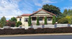  14 East Parade Deloraine TAS 7304 $980,000 This magnificent four bedroom, highly sought-after, Circa 1920, Californian Bungalow style home, retains the vast majority of its impressive architectural features. Set facing the picturesque Meander River, you will have breathtaking views daily. The grand façade is just the beginning… Features Include: - Spacious main bedroom with walk in wardrobe and ensuite - 3 additional bedrooms, 2 with built ins - Polished floorboards in main living spaces - Renovated spacious main bathroom, including deep set bath and European laundry - Light filled open plan kitchen and dining - Formal lounge with stunning box bay window, which includes ornate lead light surrounds and timber fretwork - 10 foot ceilings - Spacious hallway with ornate timber fretwork - Central gas ducted floor heating together with a period reproduction inbuilt wood heater in the lounge room - Underneath rumpus room, suitable for teenage retreat - Large front veranda with river views - 3 bay garage - Fully completed and stunning landscaping to front and rear yards - Established fruit trees - Undercover alfresco patio at the rear with built in pizza oven - Land size of approx 1600m2 Close to both primary and high schools, local cafes, supermarket, doctors, and pharmacies. 