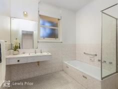  10/19 Pier Street Glenelg SA 5045 Ultra convenient, quiet and secure. This secluded single storey solid brick 2 bedroom unit sits privately at the rear of a well maintained group. Providing a great opportunity to scale down to low maintenance living or a perfect place to commence home ownership so close to the beach and Jetty Road Glenelg. Alternatively investors will see this as a fantastic money spinner on the rental roundabout. Sure to appreciate long term gain in this "blue chip" coastal location. The popular floor plan combines a large living and open kitchen meals area with rustic rich floorboards and split system heating and cooling. This warm living area has picture windows that provide a pleasant outlook to a leafy lawned yard. Other features include a generous master bedroom with built in robes and a second air conditioner. The bathroom is a good size and consists of a full bath tub, separate shower and vanity. Convenient rear access from the laundry to the private leafy rear yard. Often sought and rarely found in this location is the bonus a lock up garage under the main roof plus a designated second off street carpark. It's certainly about location here in the "Heart of the Bay" with all the lifestyle opportunities right at your fingertips. Come and embrace all that Glenelg has to offer. 