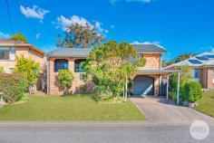  9 Norburn Ave Nelson Bay NSW 2315 Only a 3 Minute Walk to The Beach… Showcasing a spacious floorplan complemented by natural light filled interiors, this much loved north facing family home is a Nelson Bay Gem, graced with a single lock up garage plus carport and manicured lawns and gardens. Set on a superb flat parcel in a quiet street, it stands as a versatile family oasis offering breezy living, just 3 minute walk from the picturesque Little Beach and a 5 minute walk to Shoal Bay Beach. The practical layout serve to emphasise free flowing areas. A perfectly maintained front lawn leads to the entry of the home and the upper level presents a spectacular and spacious open plan lounge, dining and kitchen area that opens onto an outdoor entertaining area. Spacious and light filled, the formal living area has a split system air conditioning unit, leading out onto the front balcony. This home has plenty of scope to personalise with renovation potential. Situated just minutes to the beach, a 10 minute walk to Nelson Bay CBD and parklands, this is an opportunity not to be missed. 