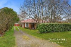 14 Henderson Ave Mittagong NSW 2575 Relishing its quiet position and the generosity of its 1411sqm parcel, this delightful brick home is being offered for the first time in 32 years. Having been at the centre of countless treasured memories, there’s a wonderful feeling of comfort and warmth here, as well as anticipation of what’s to come. The home’s interiors are modest and very well presented, while the sprawling backyard is awash with greenery and promise. Located a stone’s throw from the heart of Mittagong’s shopping and lifestyle hub, new beginnings are on the horizon and we can’t wait to show you what the future holds. Electrolux gas wall furnace in the lounge room North facing formal lounge and dining room⎪Casual meals and sitting area Spacious gas kitchen⎪Island with breakfast bar⎪Updated Westinghouse appliances Carpeted lounge and bedrooms⎪Vinyl floors in kitchen/dining Dual access bathroom⎪Bath and shower⎪Vanity⎪Toilet Built-in wardrobes in each bedroom⎪Master with bathroom access Large, paved entertainer’s patio Long side driveway⎪Secure double garage and workshop⎪Garden shed Expansive rear yard⎪Fully fenced⎪Established trees Sub division potential (STCA) 