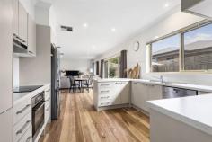  45A Balmoral St Kilsyth VIC 3137 $750,000 - $800,000 A modern, contemporary and stylish 3 bedroom home, privately positioned and conveniently located across the road from Balmoral Reserve. Presenting a boutique single level design enhanced with quality Spotted Gum solid timber floors, high ceilings, Bellini cooking appliances, and welcoming creature comforts like ducted heating, evaporative cooling and west facing double glazing windows. A home certain to please those who seek the easy lifestyle which promises minimal upkeep. Occupying a 462m2 allotment, it's a favourable option for busy families, investors and downsizers, with the benefit of having shops and schools close by, including Pembroke Primary School and Kilsyth Primary School which are both approximately 1km away. Explore a wonderful open plan layout with an adjoining kitchen and easy access to the courtyard, together with a full ensuite in the master, BIR's in the other 2 bedrooms, immaculate family bathroom with separate toilet, double garage with an internal storage area with roller door access (approx 4.5x1m), and a water tank. 