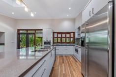  72 Timberland Road Jubilee Pocket QLD 4802 Luxury and privacy combine to create the perfect place to relax in your slice of tropical paradise. The 2.8 acre property is completed by picturesque tropical gardens and enjoys prime position on the sought-after Timberland Road just minutes from the hustle bustle of Airlie beach. From the moment you set foot on the property it's hard no to notice that quintessential resort vibe. The executive home is perfectly suited to those looking to entertain and boasts beautiful timber floors, high ceilings and stunning gourmet kitchen. The three bedrooms are spacious, with the master bedroom featuring a walk-in-robe and private, double shower and spa. Moving outside the integrated bi-fold doors lead seamlessly to the outdoor living space then onto the pool area complete with waterfall all set the backdrop of tropical gardens. Beautiful and practical the main residence is supported a dedicated office space, a separate and secure three car garage, approved high clearance 7x10m shed: The garage features it's own toilet, outdoor shower and dedicated storage spaces. 