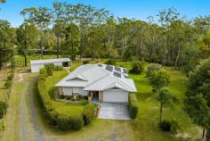  5 Sundew Close Gulmarrad NSW 2463 This stunning home is set on a large 4375m2 block, located in the ever-popular Gulmarrad area situated on the mid north coast of NSW. With a beautiful natural bush backdrop, privacy is assured with the nature reserve running along the back of the property. This is the perfect setting for this modern 4 bedroom home which is both accommodating and stylish, giving off great vibes whilst catering for the needs of a modern day family. A natural colour scheme throughout the home will compliment most furnishings and decor and the spacious design caters to the needs of a growing family, with an open plan living area that includes a contemporary kitchen, dining and family area with access to a large covered entertaining area via two large glass double sliding doors. An ideal place where you could no doubt spend a lot of time relaxing in the outdoor spa looking out onto nature and the dark skies and enjoy entertaining friends and family. Alternatively, after a long day you could just lay back in the comfort of your own media room and watch a good movie. Offering double doors to close off the space from the rest of the home, all you need is a big screen TV and some surround sound speakers and the mood is set for your own home theatre. Afterwards retreat to the huge master bedroom, featuring an attractive large ensuite with separate toilet plus a walk-in robe and sliding door access to the covered entertaining area, so you could sneak out for a late night spa without disturbing the rest of the household. Also located away from the main living areas are the other 3 bedrooms offering built-in-robes, ceiling fans and easy access to the main bathroom and laundry area. In addition to the double garage attached to the home there is a separate 4 bay colorbond shed with power, plus there is a gravel driveway to both. Another bonus is the Solar Hot Water System and 6kw Solar Power and established gardens and lawns. 