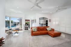  60 Rathowen Parade Killarney Heights NSW 2087 Once Upon a Time in Hollywood - Retro Palm Springs Glamour in the Heart of Killarney Heights Embracing an elevated setting with views across Garigal National Park, this splendid 1960's brick and concrete residence offers a truly unique family sanctuary in the heart of leafy Killarney Heights. Meticulously and extensively renovated to meet the demands of today's modern lifestyle, the home combines luxury custom finishes with many of its on-trend original features. Enhanced by low-maintenance tropical landscaped gardens and offering a sun-drenched north facing saltwater pool and entertaining area, it's complete with a multi-generational setup on the lower level. Optimised by an unrivalled location just footsteps to schools and village shops with Chatswood and Town Hall buses virtually at the door, this classic oasis offers a glamorous family lifestyle for those that love to entertain. North-facing lounge opens to balcony with views across the national park Separate dining room with timber accents, family and downstairs rumpus Bespoke CaesarStone gas kitchen, Bosch and Smeg appliances, servery window Light-filled living areas with high ceilings, Merbau and polished concrete flooring Master with walk-in robe and his/her ensuite bathroom with luxury steam shower EcoSmart fireplace, reverse cycle air con, ceiling fans and gas heating bayonets Internal access to the lock-up garage, copious storage/work areas throughout Secured, child and pet friendly level lawn with easy care tropical landscaping Downstairs retreat with bedroom, bathroom and living area with separate entry Tranquil leafy setting footsteps to buses, schools, village shopping and oval Floors are polished concrete and low maintenance European engineered hardwood Custom Merbau staircase, fireplace surround & desktops Rumpus room has under floor heating NBN is hardwired to all TVs and the two custom desks Steam Shower in ensuite Electrical wiring in the front garden for future installation of light and auto driveway gates. All wooden front fencing is Merbau What the current owner has liked about living here: "There are a great many plusses with the various living spaces and the pool but the most appealing is aspect of the house allows for sun to flood through the rooms as it moves from sunrise to sunset. The proximity to the Northern Beaches, Chatswood and great local shops has made for very enjoyable living." 