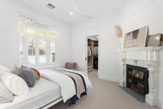  12 John St Elwood VIC 3184 $2,900,000 - $3,100,000 Sited on a double-fronted block, this builder's-own freestanding Edwardian has been superbly renovated and extended with uncompromised comfort and craftsmanship throughout its single-level design. The original façade has been retained and the interior transformed only 12 months ago into a spectacular contemporary domain perfectly attuned to modern lifestyle desires. With high ceilings carried throughout, the home's impressively proportioned floorplan showcases a show-stopping living and dining room with a luxurious amount of space, endless streams of natural light, and soaring sloped ceilings adding fantastic vertical volume. There's also a wood heater to unwind in idyllic fashion during those cooler months. Anchoring the lofty airy space is a sky-lit gourmet kitchen making it easy to indulge your culinary skills thanks to its precision functionality and the high-end inclusions of a centerpiece island bench/breakfast, white marble surfaces, Blum cabinetry, dual pyrolytic ovens, induction and gas cooktops, fridge plumbing provision, and a butler's pantry with additional sink. At the front of the home, the five-star main bedroom offers a private retreat with a window seat and a walk-through robe to a sensational ensuite bathroom with double shower and twin vanities. Three additional bedrooms are serviced by an equally stylish family bathroom with bathtub and shower. A peaceful north-facing deck and rear garden offer exceptional alfresco entertaining and relaxation complemented by the rustic brick and black cladding adorning the rear façade. The residence also benefits from a fitted home office which can be closed off for working without distraction, a full laundry room, 16kw ducted reverse-cycle heating and cooling, floor heating in the two bathrooms, extensive 8 x3 m plastered roof storage, top-of-the-range 6mm European Oak floorboards, high-quality wool carpets, Franke tapware, CCTV security, built-in speakers indoors and out, and prized off-street parking for two cars. Giving it a 'brand-new edge, the home has also been rewired, replumbed and reinsulated and fitted with a new sewer, storm water and roof. Stroll in any direction to find a fantastic selection of lifestyle amenities, including Elwood Primary and College, St Columba's Primary School, Brighton Road trams, Tennyson Village, Ripponlea Village and Station, Elsternwick Park, St Kilda Botanical Gardens, and Elwood Beach. 
