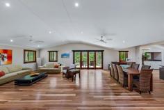  72 Timberland Road Jubilee Pocket QLD 4802 Luxury and privacy combine to create the perfect place to relax in your slice of tropical paradise. The 2.8 acre property is completed by picturesque tropical gardens and enjoys prime position on the sought-after Timberland Road just minutes from the hustle bustle of Airlie beach. From the moment you set foot on the property it's hard no to notice that quintessential resort vibe. The executive home is perfectly suited to those looking to entertain and boasts beautiful timber floors, high ceilings and stunning gourmet kitchen. The three bedrooms are spacious, with the master bedroom featuring a walk-in-robe and private, double shower and spa. Moving outside the integrated bi-fold doors lead seamlessly to the outdoor living space then onto the pool area complete with waterfall all set the backdrop of tropical gardens. Beautiful and practical the main residence is supported a dedicated office space, a separate and secure three car garage, approved high clearance 7x10m shed: The garage features it's own toilet, outdoor shower and dedicated storage spaces. 